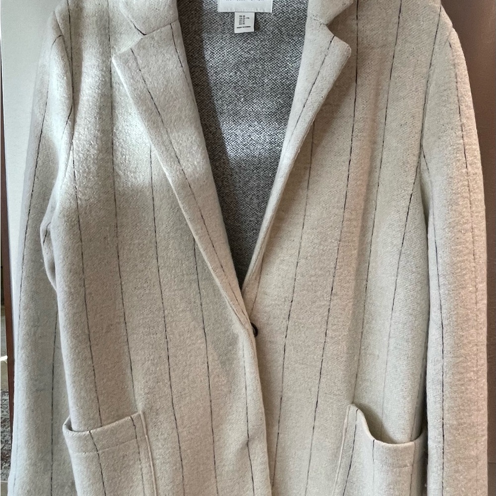Stylish white with a slight black pinstripe coat